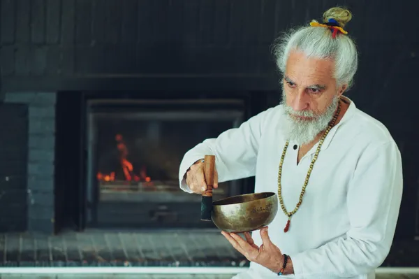 Vikrampal playing a singing bowl